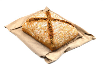 Sliced homemade sourdough rye bread with rye flour on white textured background. Top view or flat-lay.