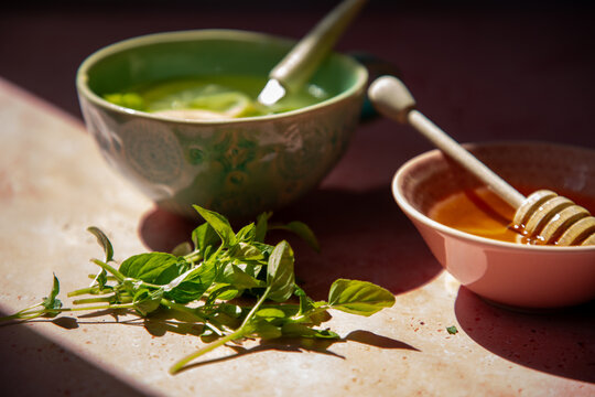 Herbal tea with honey in natural light