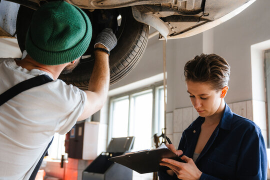 A group of people working in an auto repair shop