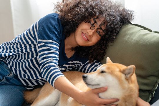 Woman enjoying time with her shiba inu dog