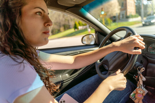 young woman driving her car 