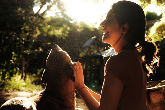 woman petting her dog