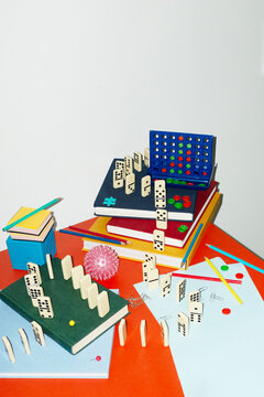 Curvy playful tactic row of dominos in office desk and hard flashlight