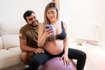 Expectant couple together at home.
