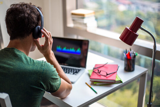 Man listening music on his computer