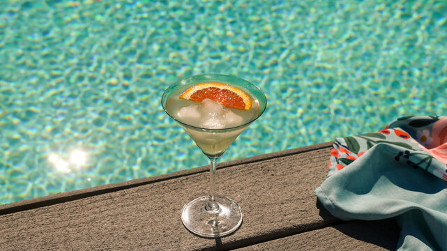 Man with a Drink by the pool