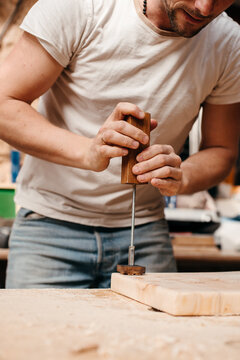Craftsman creating wood furniture