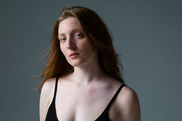 Contemplative Red-Haired Woman in Black

