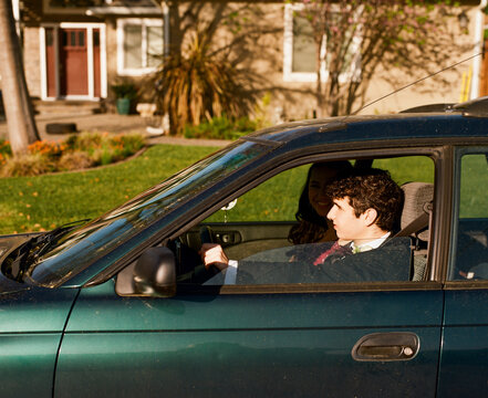 Teenage Couple Driving to Prom