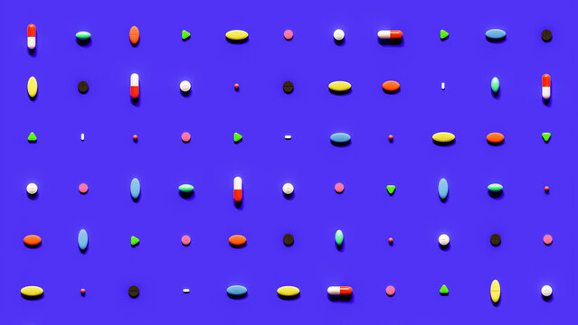 Flatlay of Colorful Pills Against Blue Background