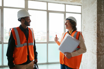 Architects examining building site