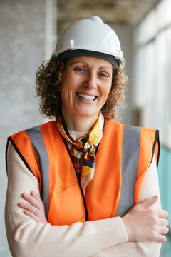 Confident builder in helmet looking at camera