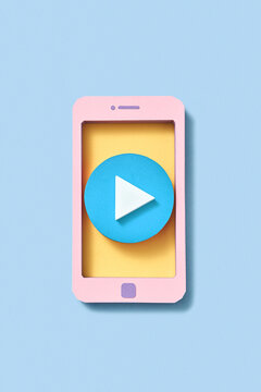 Papercraft smartphone frame with blue button play