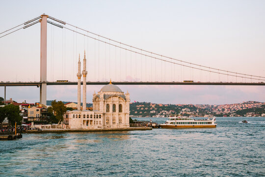 View of Ortak&ouml;y Mosque and Bridge in Istanbul at sunset