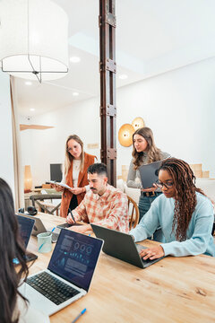 Collaborative team having casual meeting in office