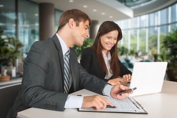 Smiling financial advisor consulting client at meeting