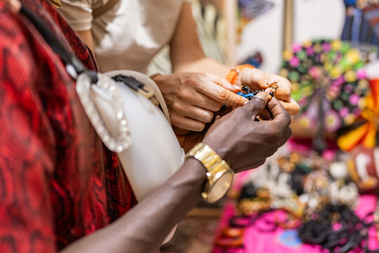 Traditional jewelry transaction in senegalese market