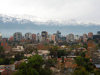View of the commune of Providencia with snowy mountain range in the background
