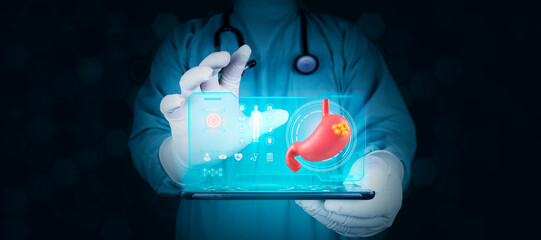 Doctor analyzes stomach cancer through a hologram projected from his tablet, Concept of technology...
