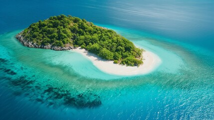Aerial view of a tropical island with lush greenery and turquoise waters.