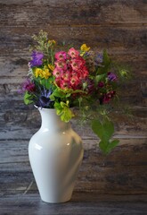 Different colorful flowers in a vase