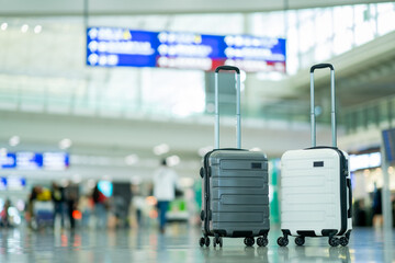 Travel, Two suitcases in an empty airport hall, traveler cases in the departure airport terminal waiting for the area, vacation concept, blank space for text message or design