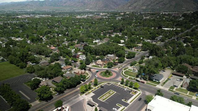 Aerial of round a bout in town of Logan Utah in spring time