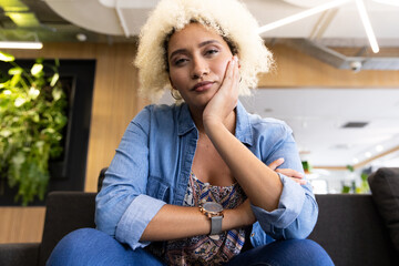Biracial young woman on video call in business office