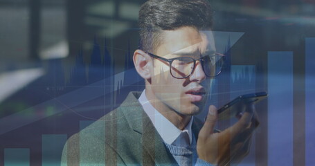 Image of data processing over caucasian businessman using smartphone