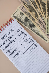 Naklejka premium Counting expenses bills on housing electricity, gas, water. Banknotes of dollar cash around. High prices for energy inflation crisis. Cut back on spending. Savings rate