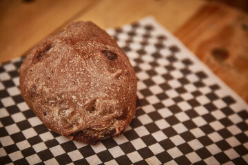 CHOCOLATE BREAD ON CHECKED PAPER