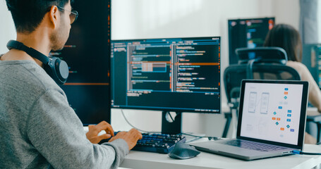 Closeup Adult Asia male, female freelance typing write prompt AI bot IT app smart program nomad, video game, terminal with coding language, user interface, designer, big data center desktop computer.