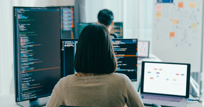 Group Adult Asia male, female freelance typing write prompt AI bot IT app smart program nomad, video game, terminal with coding language, user interface, designer, big data center on desktop computer.