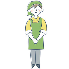 エプロンと三角巾を着けて立つ女性