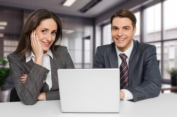 Smiling financial advisor consulting client at meeting