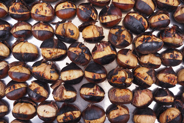 traditional Istanbul street food grilled chestnuts in a row