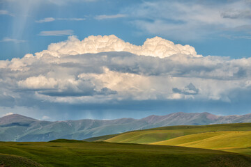 Picturesque high mountain plateau in southeast Kazakhstan on a cloudy summer day