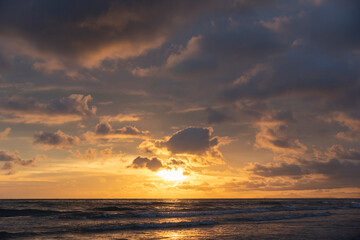 sunset scene in the bearch with colorful sky