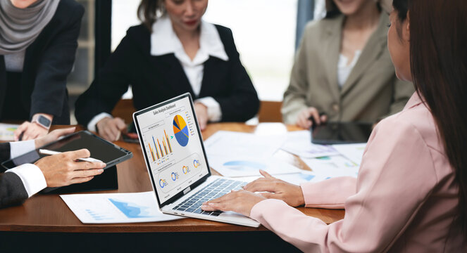 Diverse business woman workgroup team discuss paperwork financial report statistical data, forecasting working on common project. Brainstorm, briefing activity concept