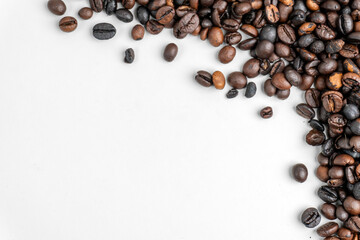 top view of pile of coffee as corner border or frame on white background
