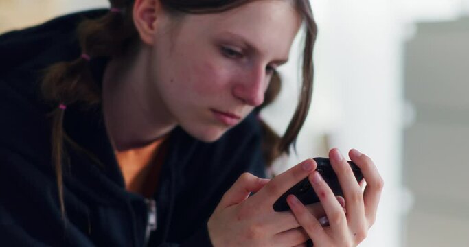 Portrait of a Sad, Delusional Teenager Reading Negative Comments About Her on Social Media