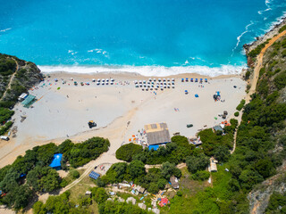 Aerial view over the Gjipe Beach coastline with sunbathers on beach between Dhermi and Himara on...