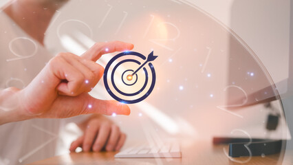 Business Goals target vision component global internet connection application technology and digital marketing Working hours man typing on a computer with a clock overlapping scheduling work hours.