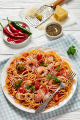 shrimp fra diavolo with spaghetti on a plate