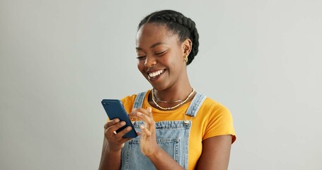 Woman, happy and typing in studio on smartphone, browsing and reading text message on mobile app on background. Communication, social media update and scrolling with internet, website and email