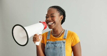 African woman, megaphone and happy in studio for deal, news or promotion with voice by white...