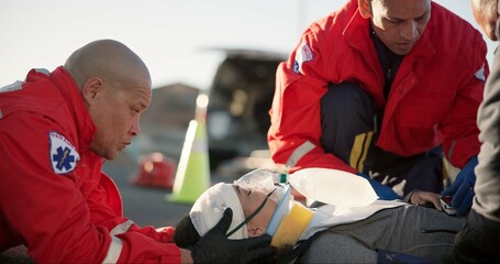 Paramedic, oxygen and outdoor with patient, ambulance and rescue of breathing, service or helping of person. EMS, accident and injury on street, healthcare and medical professional with victim in USA