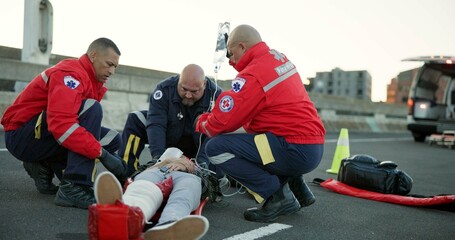People, paramedic and help patient in road on scene for emergency, rescue and support. Emt team,...