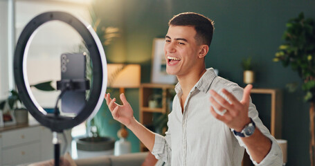 Man, light and smartphone for vlogging in house, smile and hands for yes announcement. Online, male...