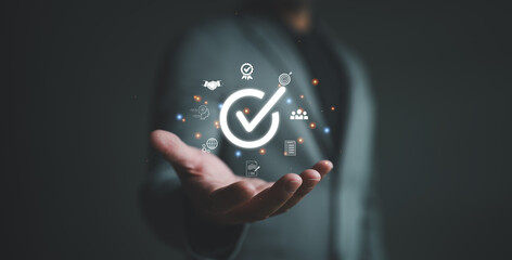 Hand shows the sign of the top service Quality assurance, the best product and service Guarantee, Standards, ISO certification and standardization concept, certificate, quality, standard, warranty.